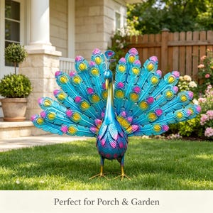 May include: A metal peacock garden sculpture featuring a vibrant gradient of blue, teal, and magenta feathers with yellow eye-like accents. The bird stands on two thin gold-colored legs with its tail feathers fanned out in a wide, semi-circular display.
