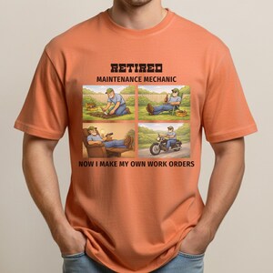 May include: Orange t-shirt with a graphic depicting a retired maintenance mechanic enjoying leisure activities. The graphic includes text that reads "RETIRED MAINTENANCE MECHANIC" and "NOW I MAKE MY OWN WORK ORDERS."