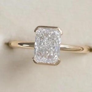 Radiant Cut Moissanite Engagement Ring: 14K Yellow Gold Half Bezel Solitaire