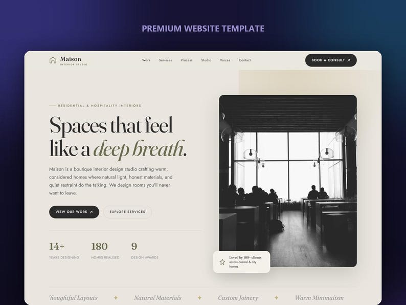 May include: A website template for Maison Interior Studio featuring a cream-colored background with black text. The layout includes the heading Spaces that feel like a deep breath, navigation links, a black and white interior photograph, and statistics.