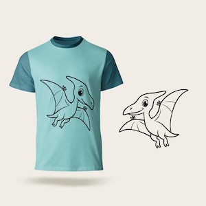 May include: A light blue t-shirt with a cartoon pterodactyl design in black. The shirt has a two-tone design, with darker blue sleeves and a neckline. A matching pterodactyl illustration is next to the shirt.