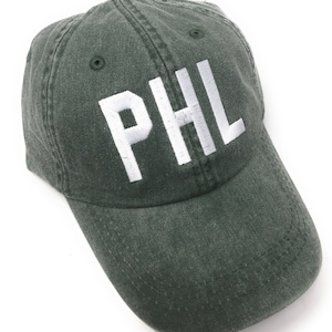 Custom Embroidered PHL Philadelphia International Airport Code Baseball Hat (spruce green with white letters)