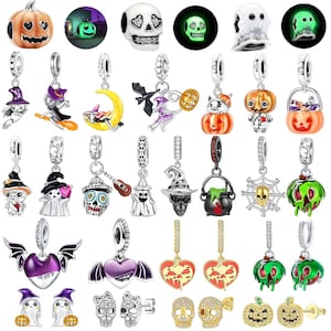 May include: A selection of Halloween-themed charms and pendants. Designs include pumpkins, ghosts, skulls, witches, bats, and cauldrons. Some charms glow in the dark. The charms are silver-toned with colourful enamel accents, ideal for bracelets or necklaces.