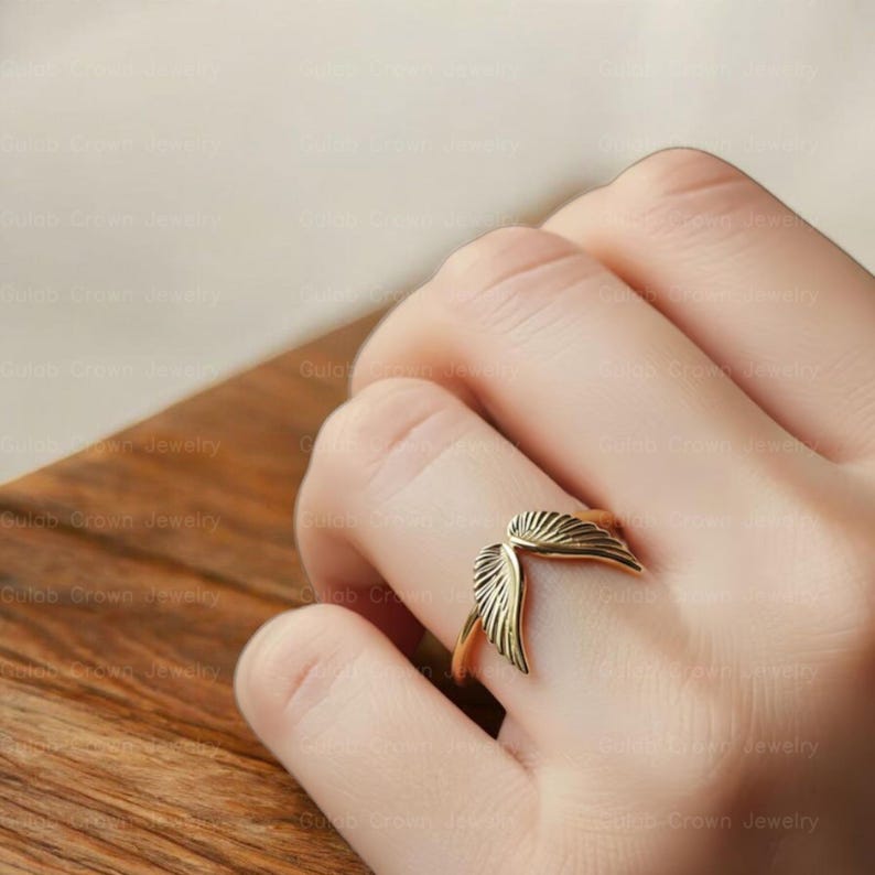 angel wings ring
wing ring silver
sterling silver ring
adjustable wing ring
minimalist ring
symbolic jewelry
dainty silver ring
everyday ring women
open ring design
feather wing ring
gift for her
modern silver ring
handmade style ring