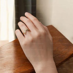 angel wings ring
wing ring silver
sterling silver ring
adjustable wing ring
minimalist ring
symbolic jewelry
dainty silver ring
everyday ring women
open ring design
feather wing ring
gift for her
modern silver ring
handmade style ring