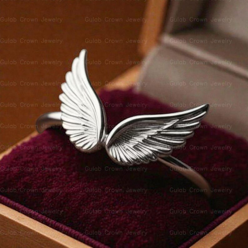 angel wings ring
wing ring silver
sterling silver ring
adjustable wing ring
minimalist ring
symbolic jewelry
dainty silver ring
everyday ring women
open ring design
feather wing ring
gift for her
modern silver ring
handmade style ring