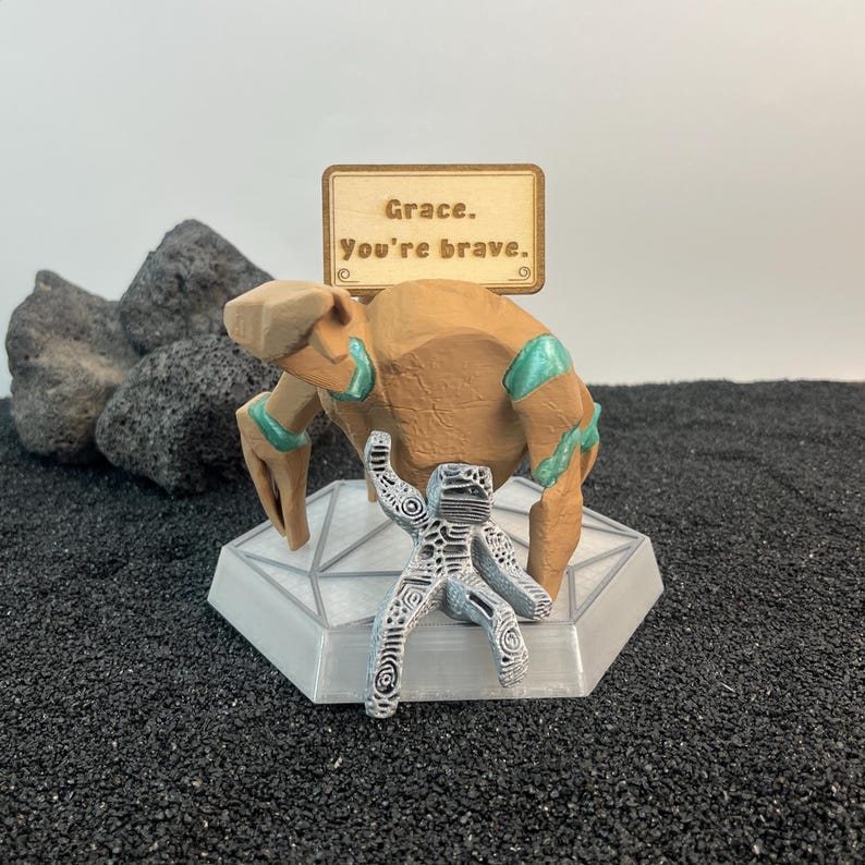 Project Hail Mary Rocky and Grace figure with iconic upside-down thumbs-up pose and RGB sci fi display base