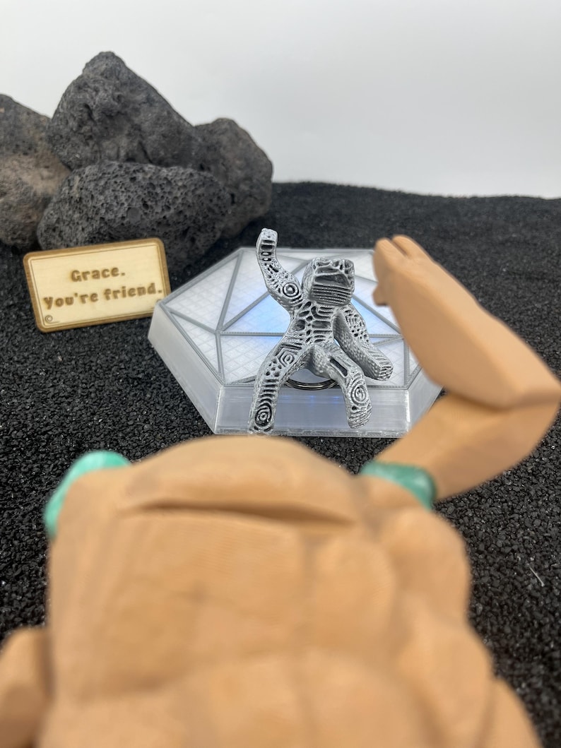 Cute Rocky companion figure with upside-down thumbs-up gesture from Project Hail Mary for Andy Weir fans