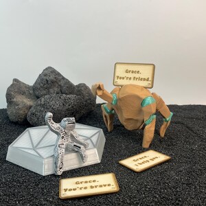 Rocky and Grace fan art collectible with customizable message sign, unique sci fi bookshelf decor inspired by Project Hail Mary and space adventure stories