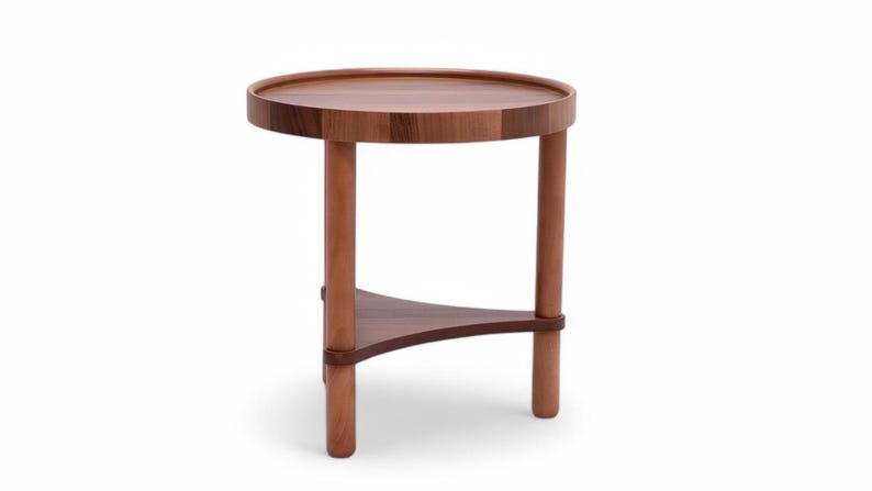 May include: A small, round wooden side table with a dark brown tabletop and three cylindrical legs. A triangular shelf connects the legs. The table is approximately 50 cm in height.