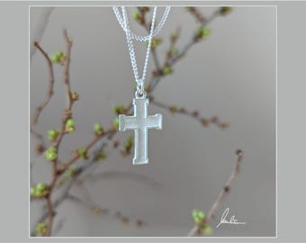 Silver cross, finely textured