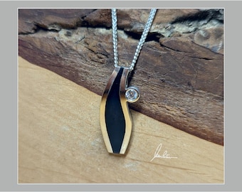 Pendant, elegantly colored in silver and black