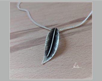 Silver leaf and feather pendant