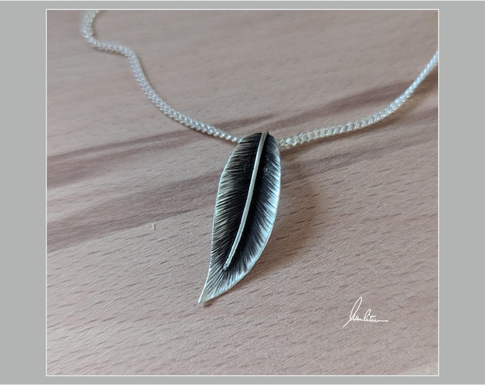 Silver leaf and feather pendant
