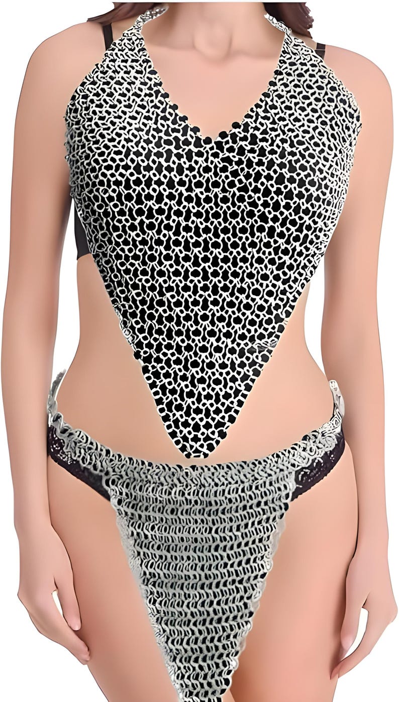 May include: A halter top and bottom set with a chainmail design. The top is a V-neck style with a black and white pattern. The bottom is a matching chainmail design with black lace trim.