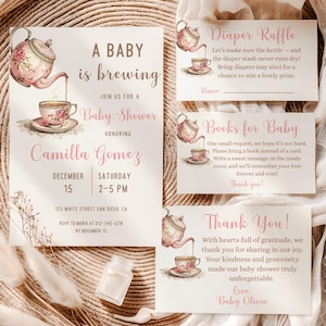 May include: Baby shower invitation set with a watercolor illustration of a teapot pouring tea into a teacup. The invitation reads "A Baby is Brewing" and includes details for Camilla Gomez's baby shower. Includes diaper raffle, book request, and thank you cards.