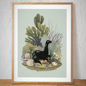 May include: A framed art print featuring a black dinosaur-like creature amidst a colorful underwater scene. The illustration includes various sea plants, shells, and a light green background. The artwork is encased in a wooden frame.