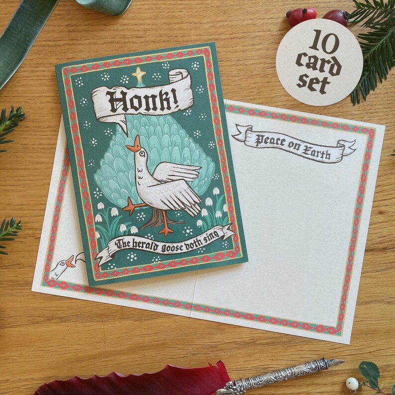 May include: A set of 10 Christmas cards with a whimsical goose design. The cards feature a green border and the text "Honk!" and "The herald goose both sing." The accompanying envelope reads "Peace on Earth."