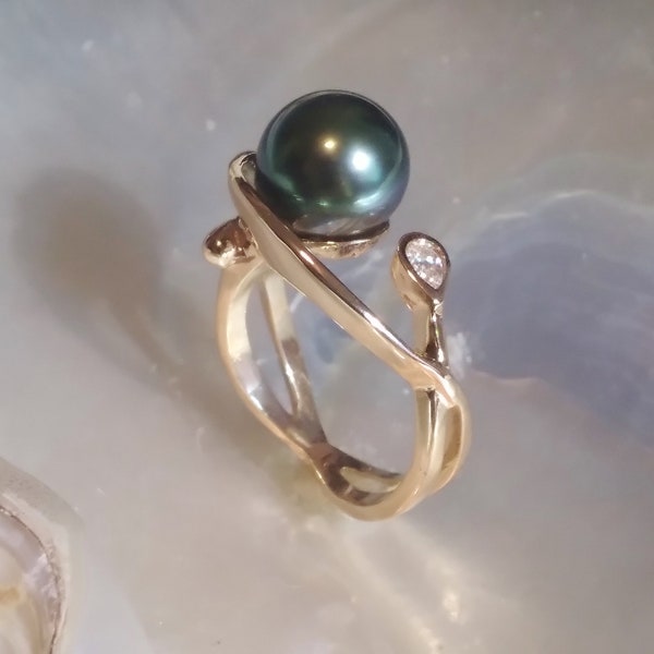 Tahitian Black pearl ring titled "Mana Vai" in 14kt gold w/diamond