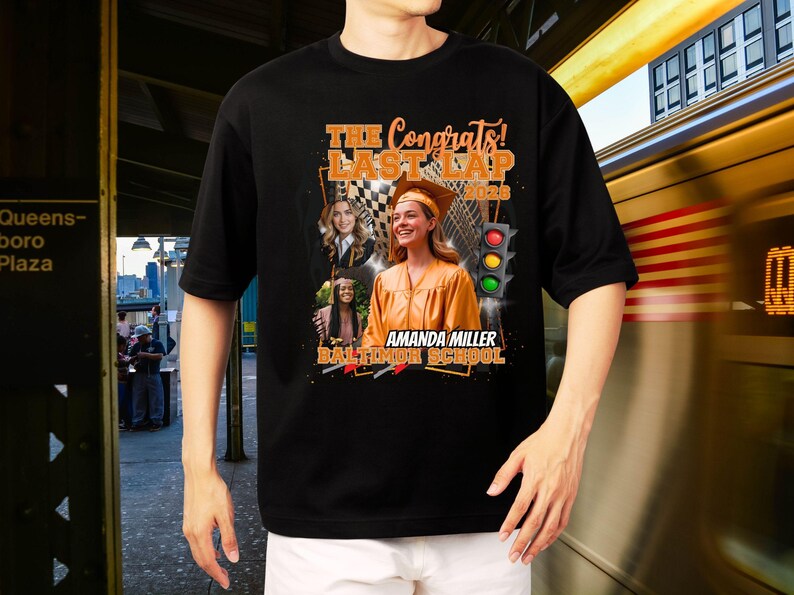 May include: Black t-shirt with a graduation-themed graphic. The design includes the text "The Congrats! Last Lap 2023", a photo of a graduate, a checkered flag, and a traffic light. The shirt also includes the name "Amanda Miller" and "Baltimore School".