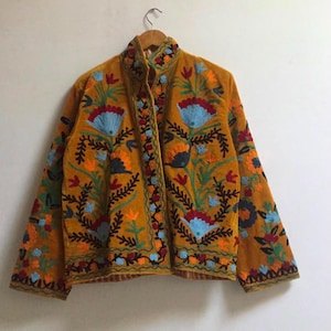 Velvet, Suzani, Jacket, Coat, Boho, Bohemian, Embroidered, Handmade, Artisan, Rabbit, Bunny, Floral, Flowers, Vintage, Ethnic, Traditional, Uzbek, Indian, Fashion, Outerwear, Winter, Casual, Festival, Gift, Womens, Unisex, Luxury, Elegant, Colorful, Soft, Cotton, Lining, Designer, Unique, Folk, Motif, Stitching, Needlework, Craftsmanship, Heritage, Boutique, Trendy, Statement, Layering, Cozy, Warm, Short, Premium, Stylish, Wearable.