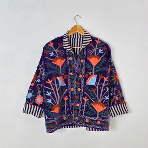 Velvet, Suzani, Jacket, Coat, Boho, Bohemian, Embroidered, Handmade, Artisan, Rabbit, Bunny, Floral, Flowers, Vintage, Ethnic, Traditional, Uzbek, Indian, Fashion, Outerwear, Winter, Casual, Festival, Gift, Womens, Unisex, Luxury, Elegant, Colorful, Soft, Cotton, Lining, Designer, Unique, Folk, Motif, Stitching, Needlework, Craftsmanship, Heritage, Boutique, Trendy, Statement, Layering, Cozy, Warm, Short, Premium, Stylish, Wearable.