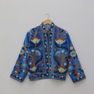 Velvet, Suzani, Jacket, Coat, Boho, Bohemian, Embroidered, Handmade, Artisan, Rabbit, Bunny, Floral, Flowers, Vintage, Ethnic, Traditional, Uzbek, Indian, Fashion, Outerwear, Winter, Casual, Festival, Gift, Womens, Unisex, Luxury, Elegant, Colorful, Soft, Cotton, Lining, Designer, Unique, Folk, Motif, Stitching, Needlework, Craftsmanship, Heritage, Boutique, Trendy, Statement, Layering, Cozy, Warm, Short, Premium, Stylish, Wearable.