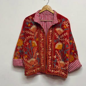 Velvet, Suzani, Jacket, Coat, Boho, Bohemian, Embroidered, Handmade, Artisan, Rabbit, Bunny, Floral, Flowers, Vintage, Ethnic, Traditional, Uzbek, Indian, Fashion, Outerwear, Winter, Casual, Festival, Gift, Womens, Unisex, Luxury, Elegant, Colorful, Soft, Cotton, Lining, Designer, Unique, Folk, Motif, Stitching, Needlework, Craftsmanship, Heritage, Boutique, Trendy, Statement, Layering, Cozy, Warm, Short, Premium, Stylish, Wearable.