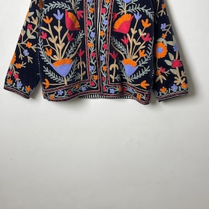 Velvet, Suzani, Jacket, Coat, Boho, Bohemian, Embroidered, Handmade, Artisan, Rabbit, Bunny, Floral, Flowers, Vintage, Ethnic, Traditional, Uzbek, Indian, Fashion, Outerwear, Winter, Casual, Festival, Gift, Womens, Unisex, Luxury, Elegant, Colorful, Soft, Cotton, Lining, Designer, Unique, Folk, Motif, Stitching, Needlework, Craftsmanship, Heritage, Boutique, Trendy, Statement, Layering, Cozy, Warm, Short, Premium, Stylish, Wearable.