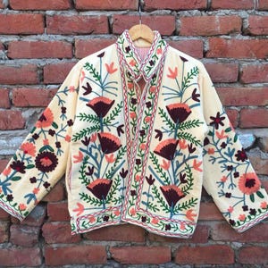 Velvet, Suzani, Jacket, Coat, Boho, Bohemian, Embroidered, Handmade, Artisan, Rabbit, Bunny, Floral, Flowers, Vintage, Ethnic, Traditional, Uzbek, Indian, Fashion, Outerwear, Winter, Casual, Festival, Gift, Womens, Unisex, Luxury, Elegant, Colorful, Soft, Cotton, Lining, Designer, Unique, Folk, Motif, Stitching, Needlework, Craftsmanship, Heritage, Boutique, Trendy, Statement, Layering, Cozy, Warm, Short, Premium, Stylish, Wearable.