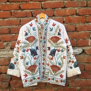 Velvet, Suzani, Jacket, Coat, Boho, Bohemian, Embroidered, Handmade, Artisan, Rabbit, Bunny, Floral, Flowers, Vintage, Ethnic, Traditional, Uzbek, Indian, Fashion, Outerwear, Winter, Casual, Festival, Gift, Womens, Unisex, Luxury, Elegant, Colorful, Soft, Cotton, Lining, Designer, Unique, Folk, Motif, Stitching, Needlework, Craftsmanship, Heritage, Boutique, Trendy, Statement, Layering, Cozy, Warm, Short, Premium, Stylish, Wearable.