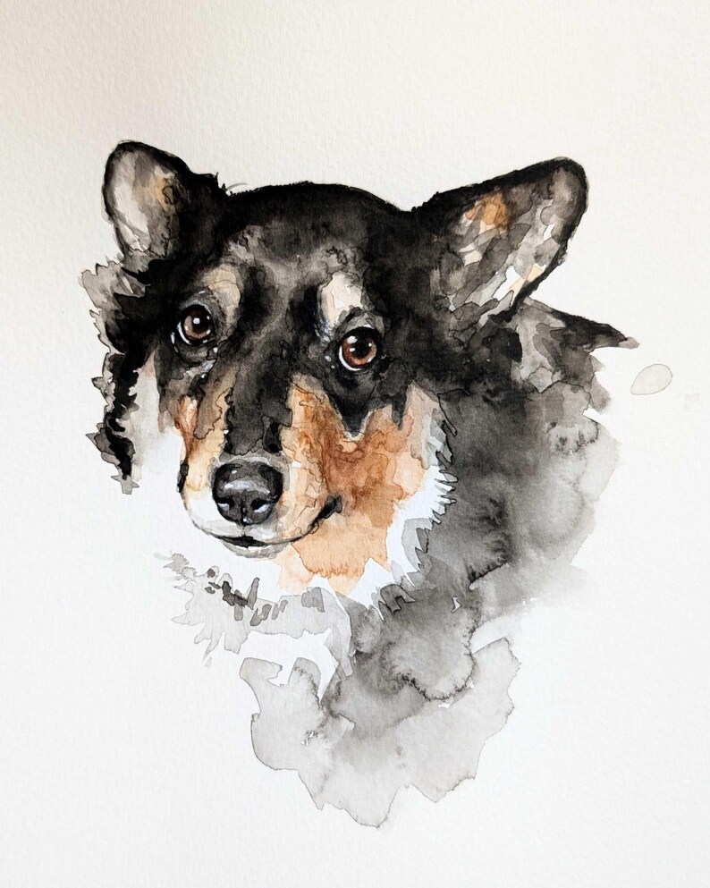 May include: Watercolor painting of a dog's head. The dog has black, brown, and tan fur with brown eyes and a black nose. The painting has a soft, artistic style with watercolor washes of gray and black.