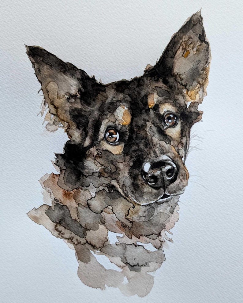 May include: Watercolor painting of a dog's head, featuring a black and brown coat with tan highlights. The dog has attentive brown eyes and a black nose. The artwork is detailed, with visible brushstrokes and a soft, textured appearance.