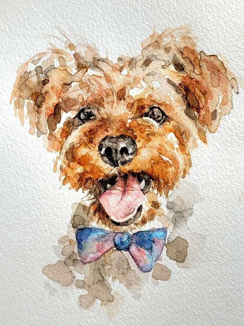 May include: Watercolor painting of a happy dog with brown fur, a black nose, and a pink tongue sticking out. The dog wears a blue and pink bow tie. The artwork is on a white background.