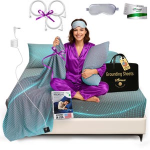 May include: A woman in purple pajamas sits on a bed with a blue and gray patterned sheet set. The set includes a pillow, eye mask, and a black tote bag labeled "Grounding Sheets." Accessories include earthing cables and an instruction manual.