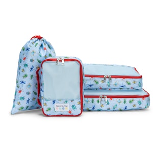 May include: A set of light blue travel organizers with a bug and dragonfly pattern. The set includes a drawstring bag, a mesh-fronted cube, and two zippered packing cubes. The edges are trimmed in red, and the cube has the text "macaron+me".