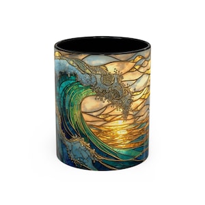 May include: A ceramic coffee mug with a stained-glass design of a wave. The wave is depicted in shades of blue and green, with gold accents and a sunset background. The interior of the mug is black.