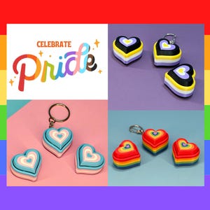 May include: A collage of Pride-themed heart-shaped keychains and a graphic that says "Celebrate Pride". The keychains feature the colors of the non-binary, transgender, and rainbow pride flags. The background is a rainbow gradient.