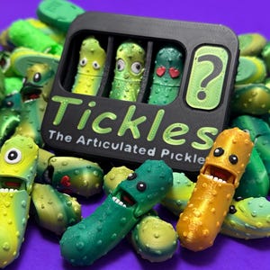 May include: A collection of articulated pickle toys in various shades of green and yellow, with some featuring open mouths and expressive faces. A black container holds three pickles and a question mark. The text "Tickles The Articulated Pickle" is displayed.