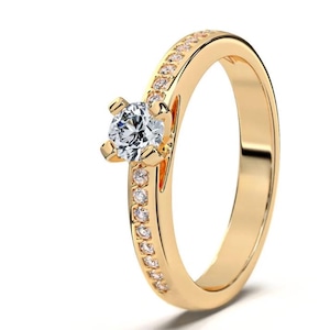 Diamond ring made of 585 yellow gold with sparkling center stone,