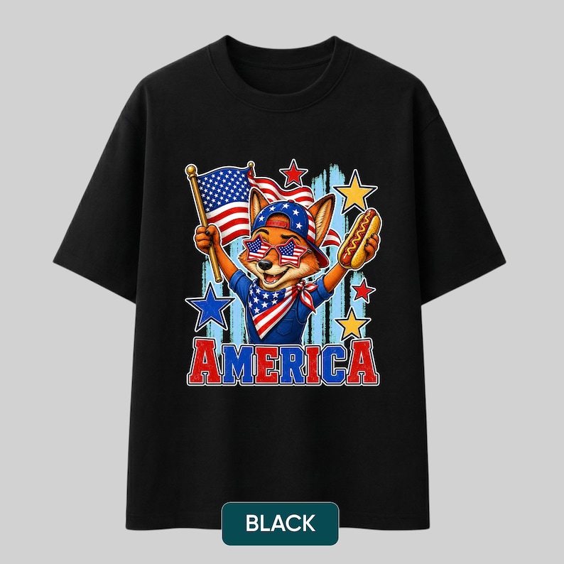 May include: A black t-shirt featuring a graphic of a fox wearing a star-spangled baseball cap, star-shaped sunglasses, and a bandana. The fox holds an American flag and a hot dog. The word AMERICA is printed in red and blue below the illustration.