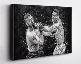 May include: Black and white framed print of a mixed martial arts fight. Two fighters are mid-action, with one throwing a punch. The image has a splatter effect, adding to the dynamic feel. The fighters are wearing gloves and shorts.
