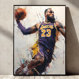 May include: A framed art print of a basketball player in action, wearing a purple and gold Lakers jersey with the number 23. The artwork features an abstract, painterly style with splashes of color and a dynamic pose, holding a basketball.