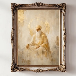 May include: A framed painting depicting a figure with a long white beard and a turban, seated in a meditative pose. The artwork features a golden halo behind the figure, rendered in shades of cream, beige, and gold with a textured, ornate frame.