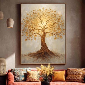 May include: A framed artwork shows a golden tree with a textured trunk and branches, set against a soft, light background. The tree's leaves are also golden, and the roots are visible. The artwork is displayed above a red sofa with decorative cushions.