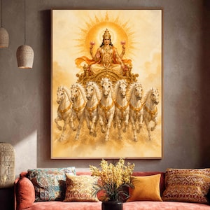 May include: A rectangular wall art print featuring a golden-toned illustration of a deity seated on a chariot pulled by seven white horses. The figure wears an ornate crown and holds lotus flowers, set against a radiant, sun-like circular background.