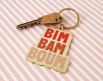 Porte-clés en émail "Bim Bam Boum" or et dégradé orange