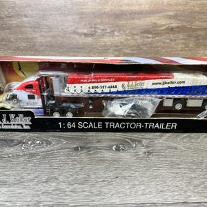 DCP JJ Keller Peterbilt 387 with Flat Trailer Covered Load 1/64