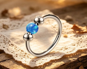 Naadloze blauwe opaal titanium stalen ring, 1,0 x 10 mm neustussenschot kraakbeenpiercing sieraden