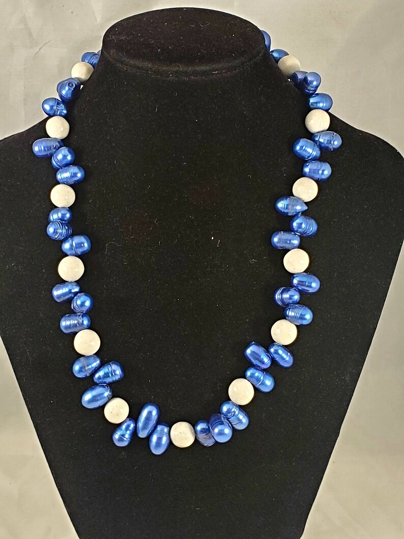 Necklace and earrings made with fresh water pearls dyed blue